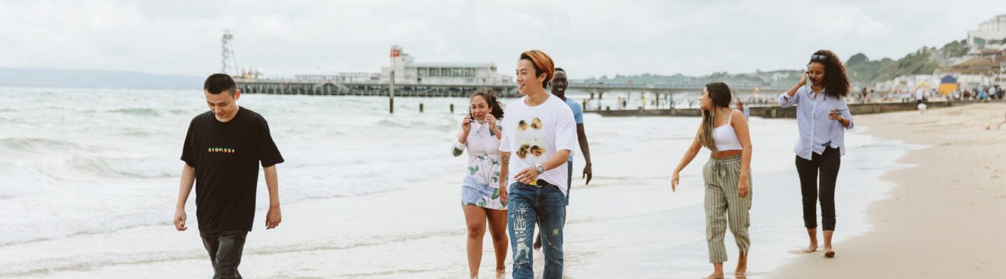 Students having fun on the beach in Bournemouth