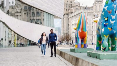 Students laughing and walking in Liverpool city centre