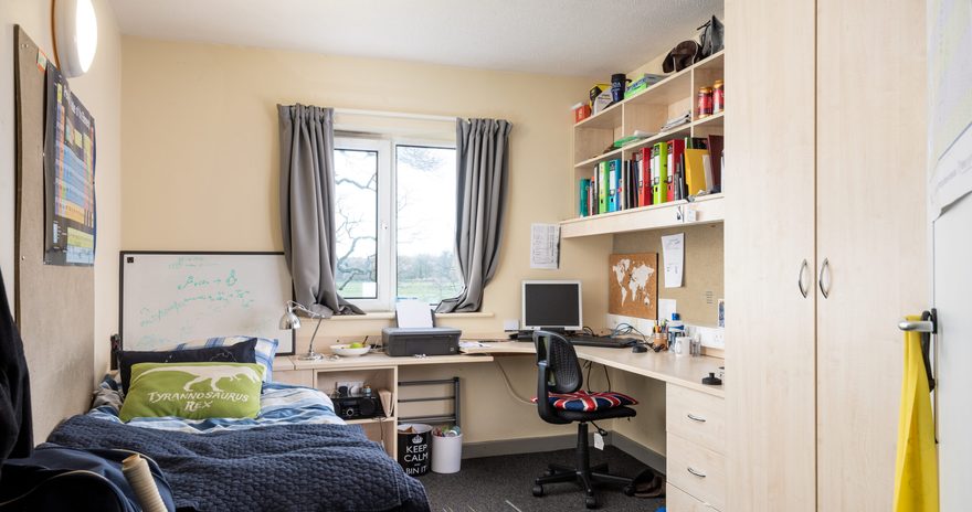 bed by the window and desk plus wardrobe in the ensuite at wentworth college