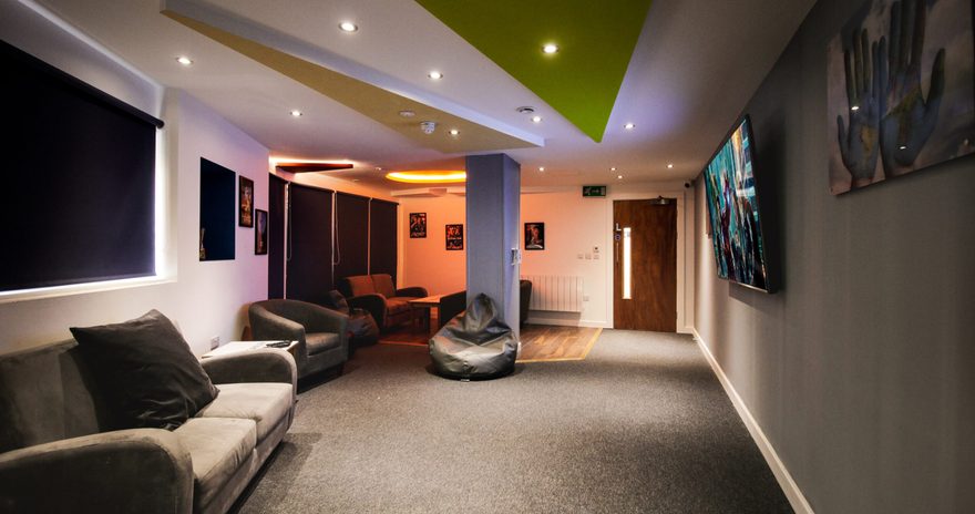 The cinema romm with poofs armchairs and sofas at Stanley House