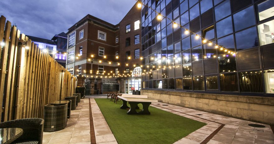 A well-lit garden/patio area outside Stanley House