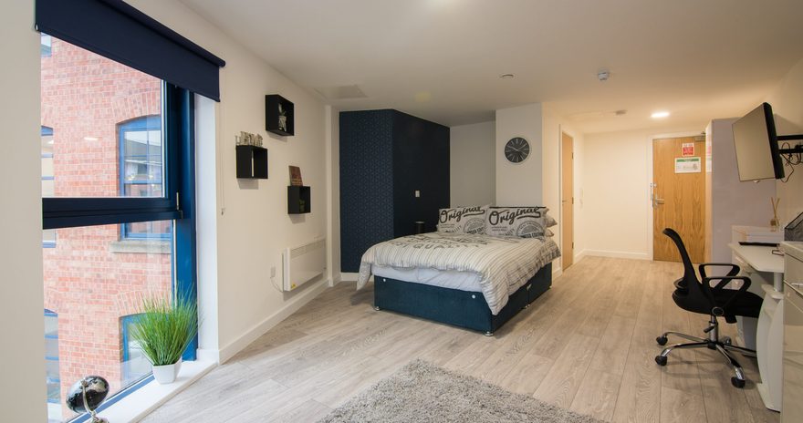 The wardrobe bed and desk in the studio at Stanley House