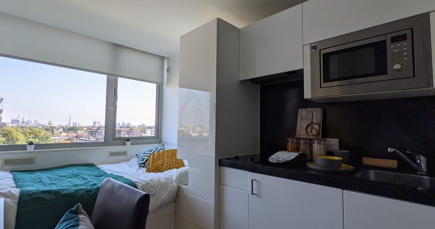 An angle of the sapphire studio with the bed and kitchenette