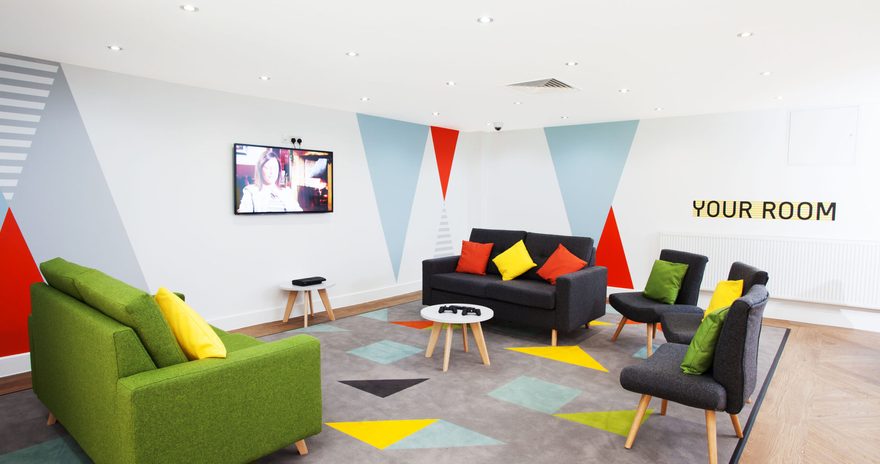 Common room with a TV and sofas in Kelvin Court residence