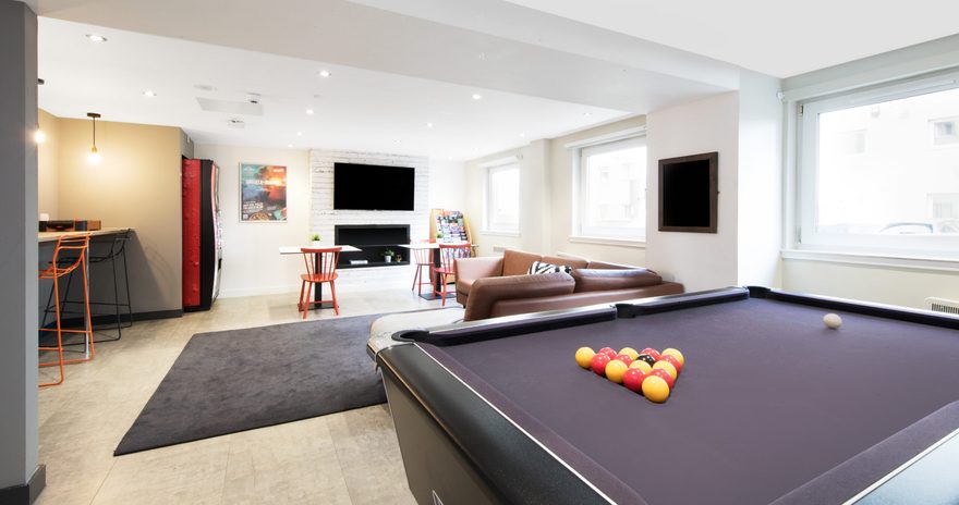 Common space with tables and a pool table