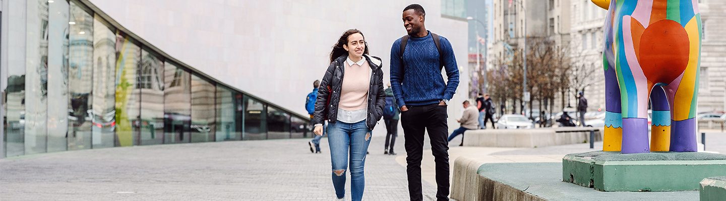 Students laughing and walking in Liverpool city centre