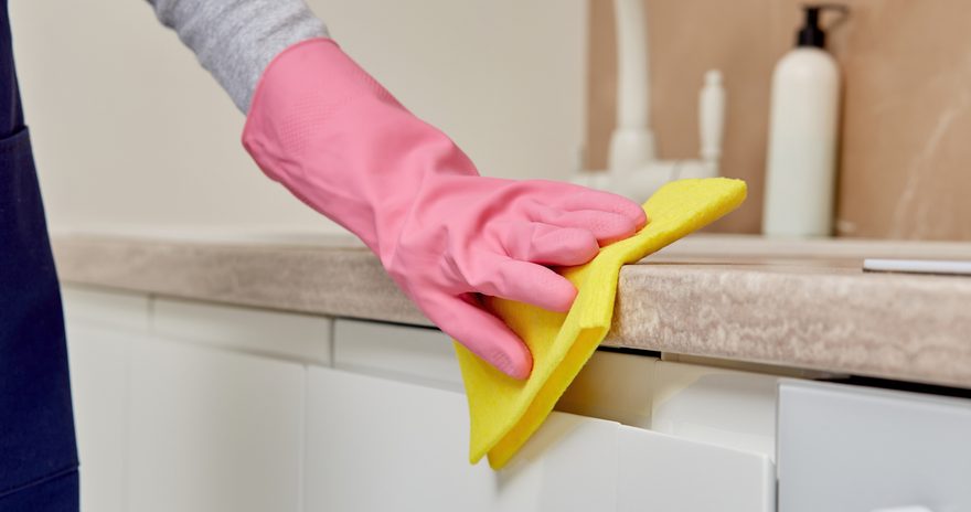 A woman cleaning the bathtub