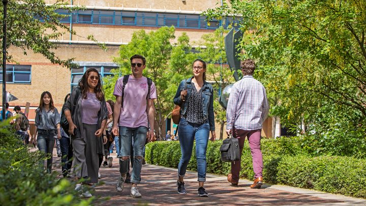 Students walking around QMUL campus