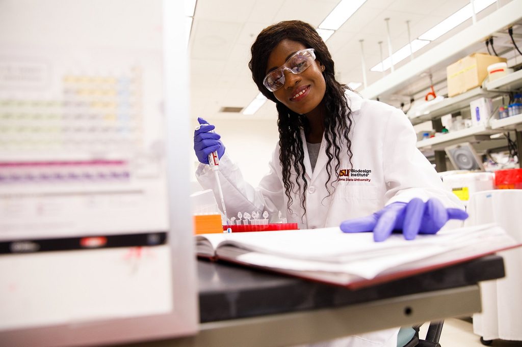 Student Ntombizodwa Makuyana from Harare, Zimbabwe works in a lab in the Biodesign Institute
