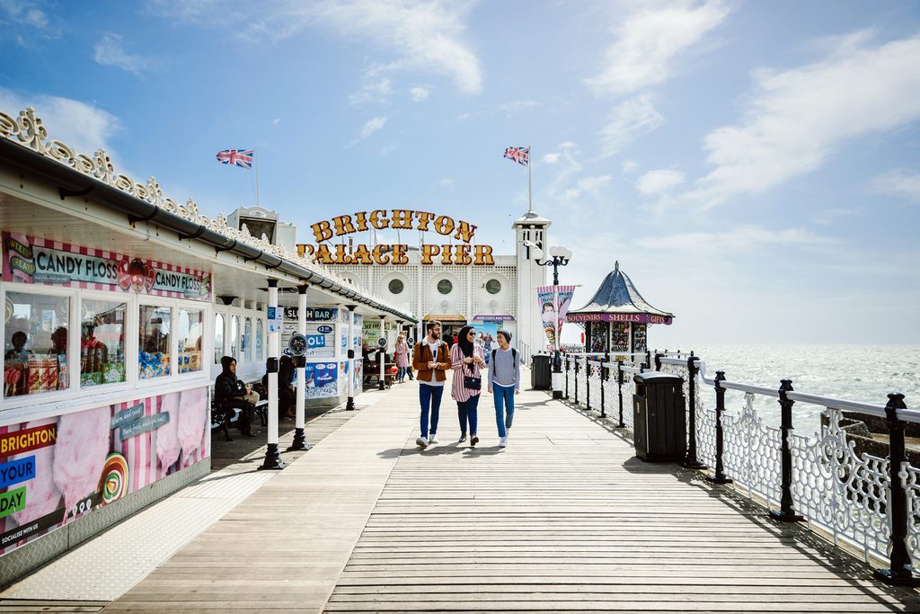 Students walking on Brighton palace pier