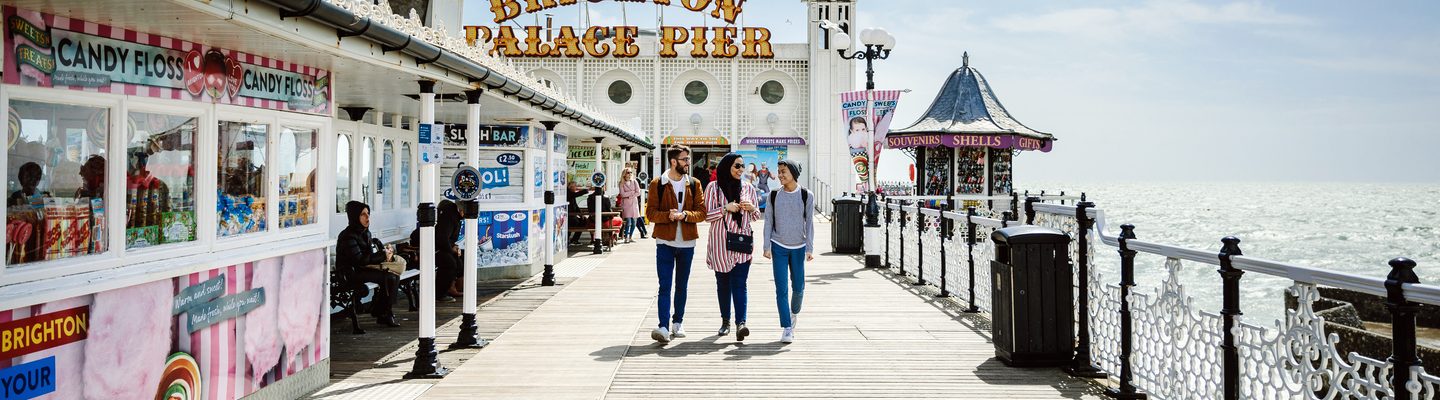 Students walking on Brighton palace pier