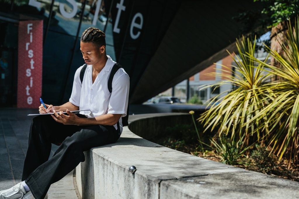 Student studying inside university campus