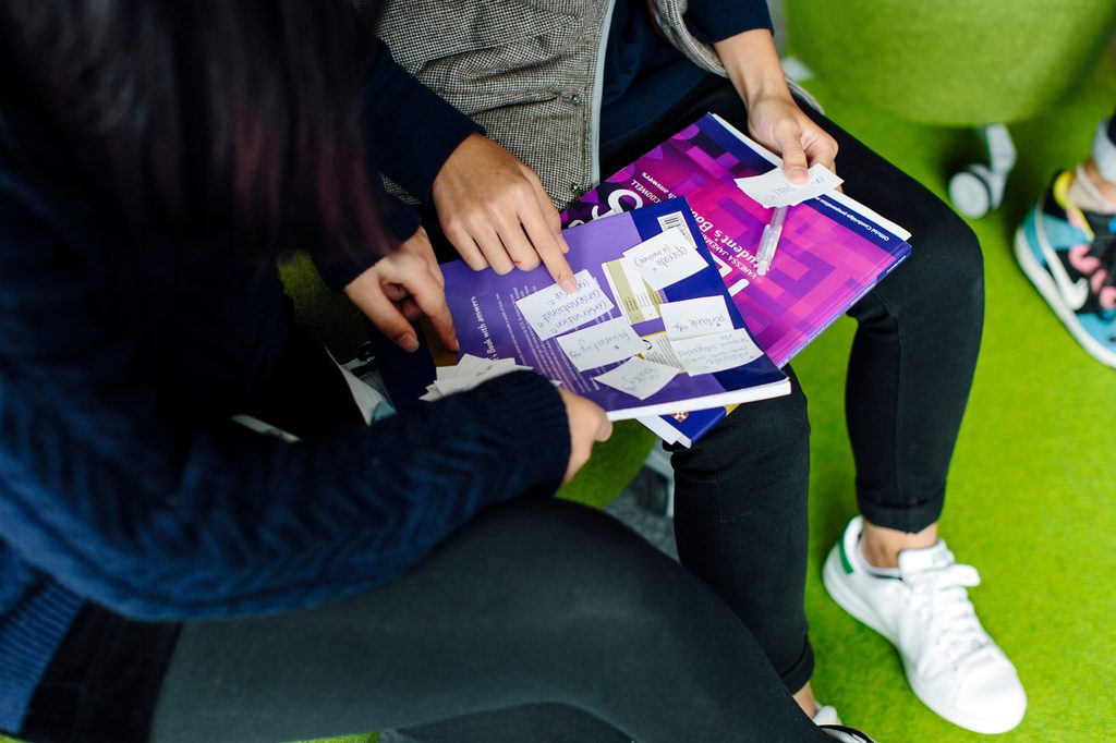 Students looking at notes