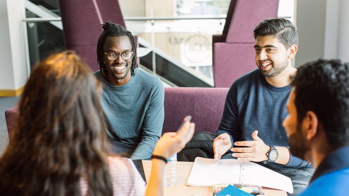 Students talking and studying together