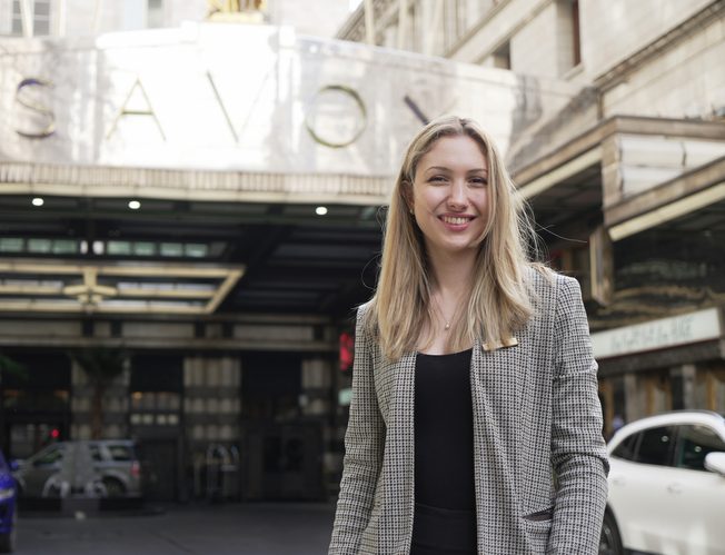 Testimonial from alumni in front of the Savoy London