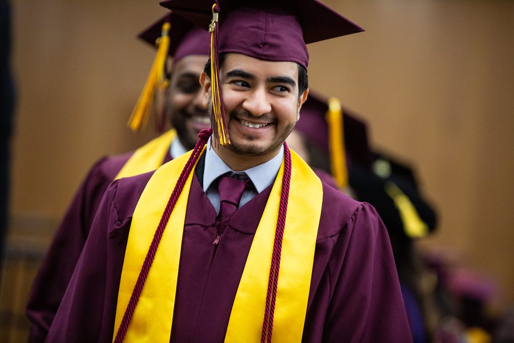 Business technology graduate Fahad Ibrahim lines up to process out during the International Student Convocation at the Student Pavilion on Tempe campus
