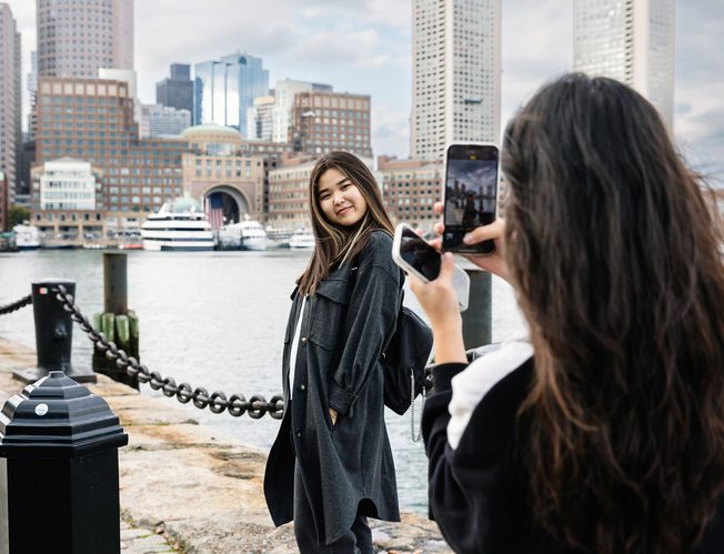 Students are taking pictures at the Boston Harbor