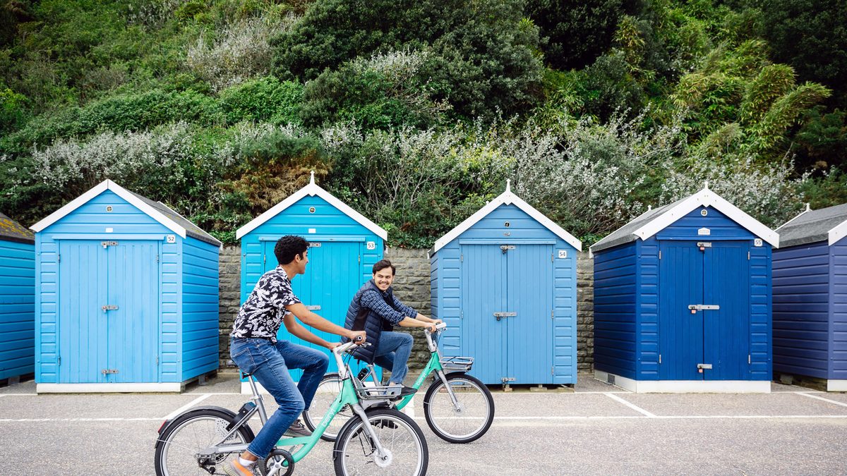 Two BUIC students riding on bikes