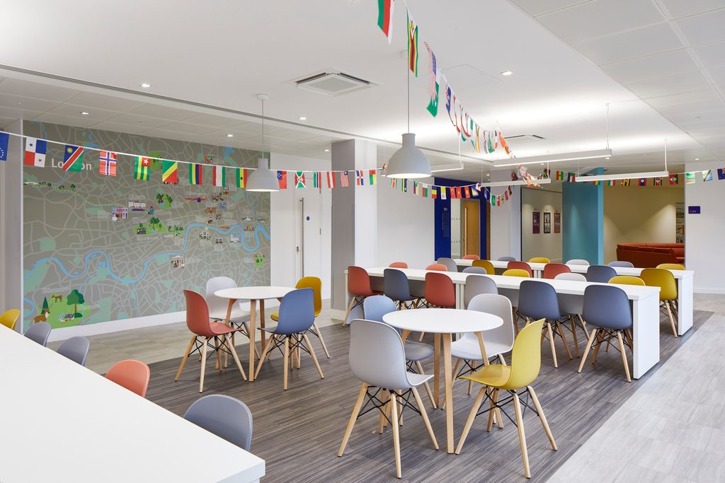 KICL campus room with tables and chairs