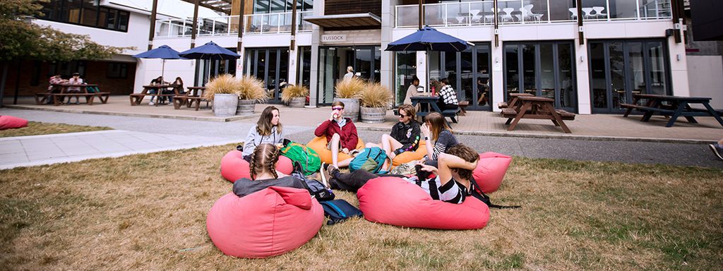 Massey University students relaxing on bean bags