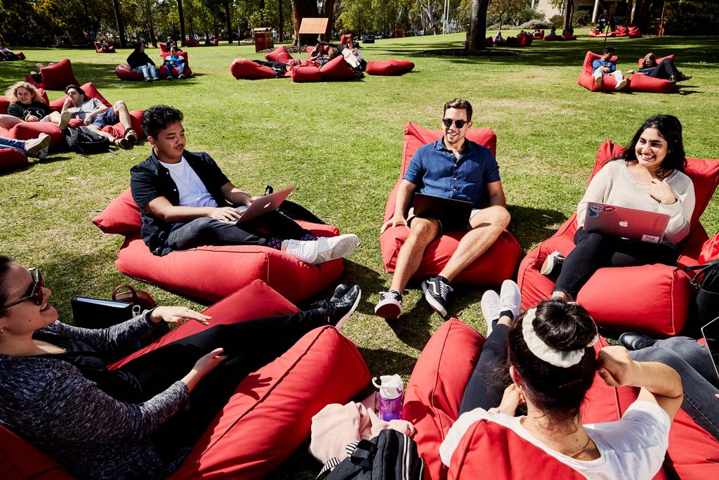 Murdoch University students relaxing on bean bags