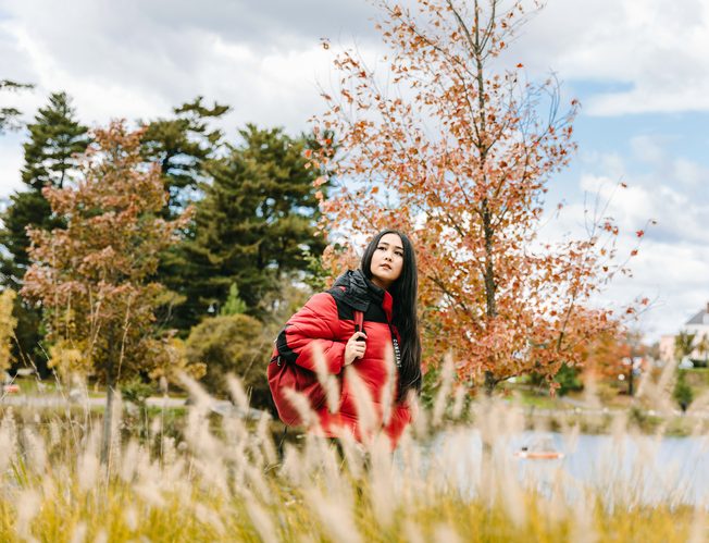 A student walking through Central Park