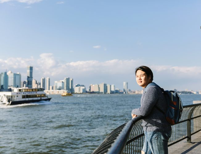A student looking over the Hudson River in New York