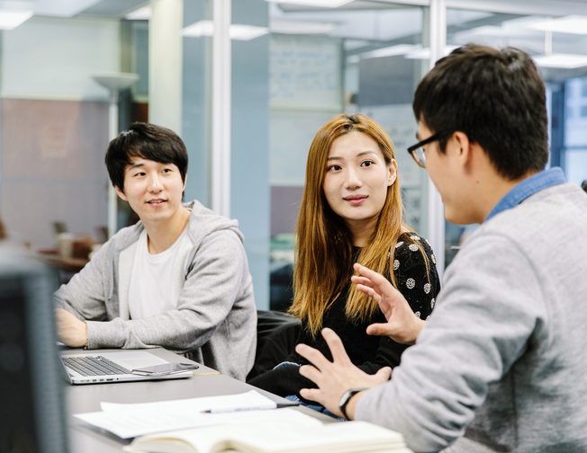 Pace students chatting in a classroom