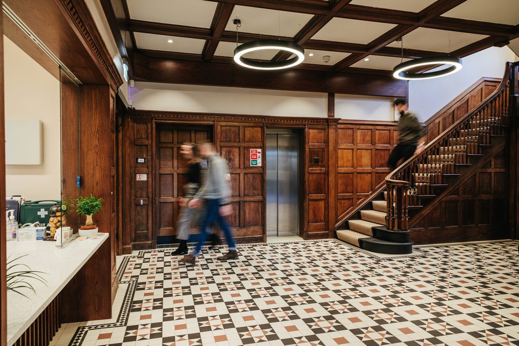 Students walking down the stair in the Priorsfield Building