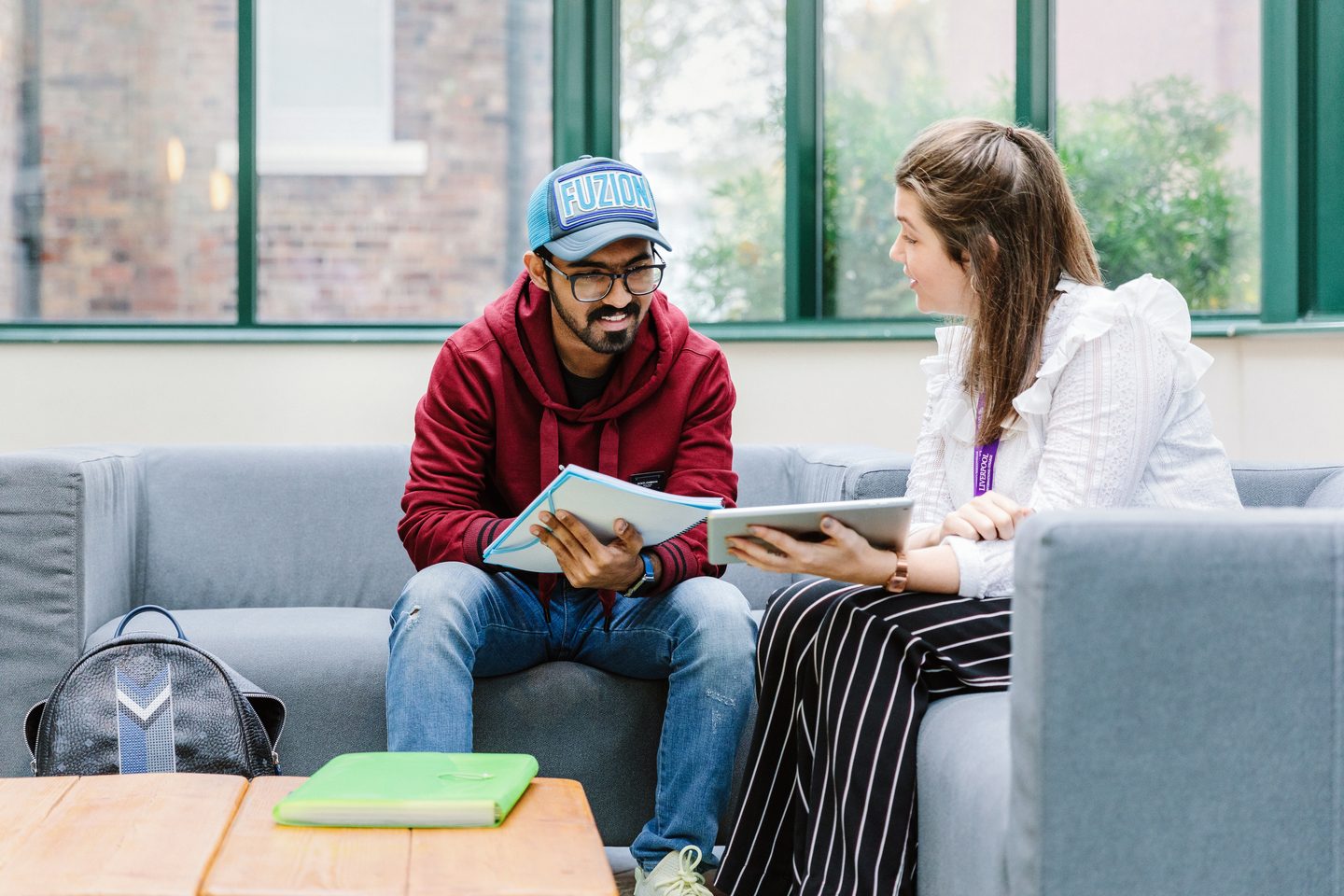 A student talking with a college director