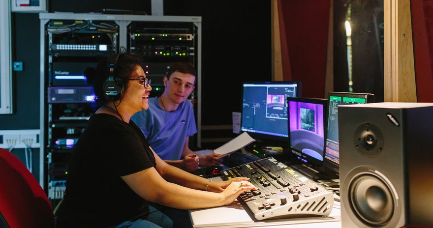 Students in a recording studio using the equipments