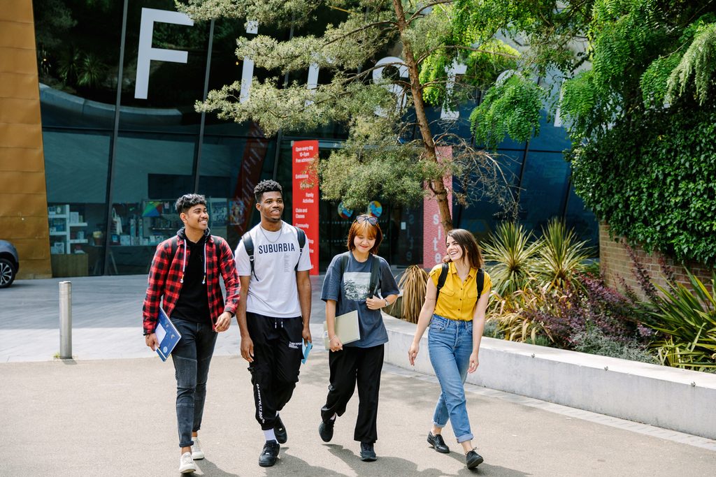 Students walking together inside the university campus