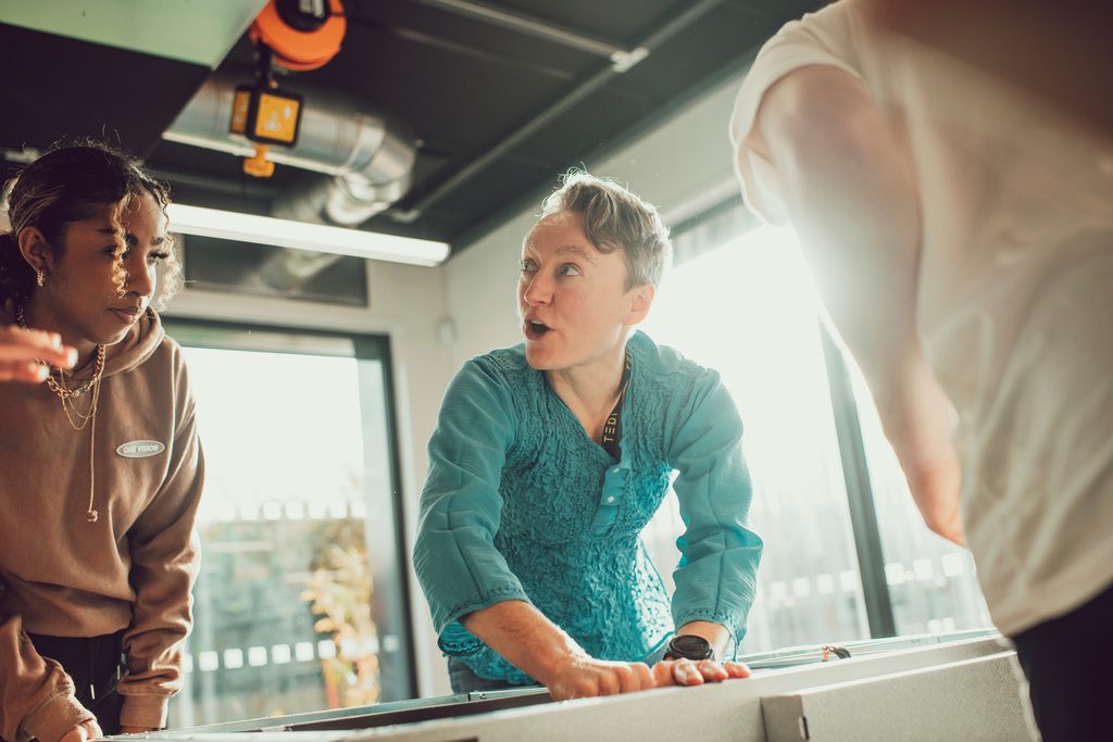 teacher working with students
