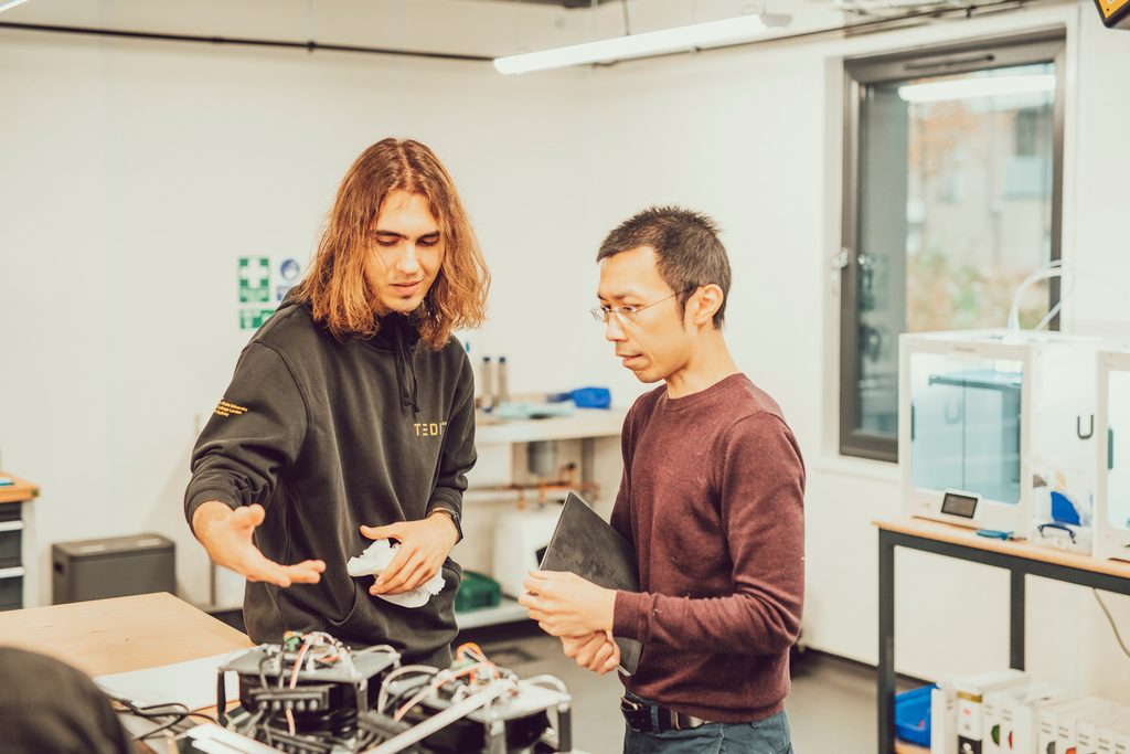 students working together on electronics