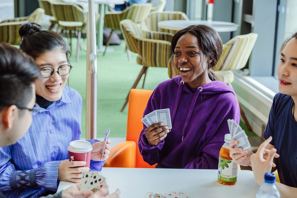 Students playing cards and having a god time