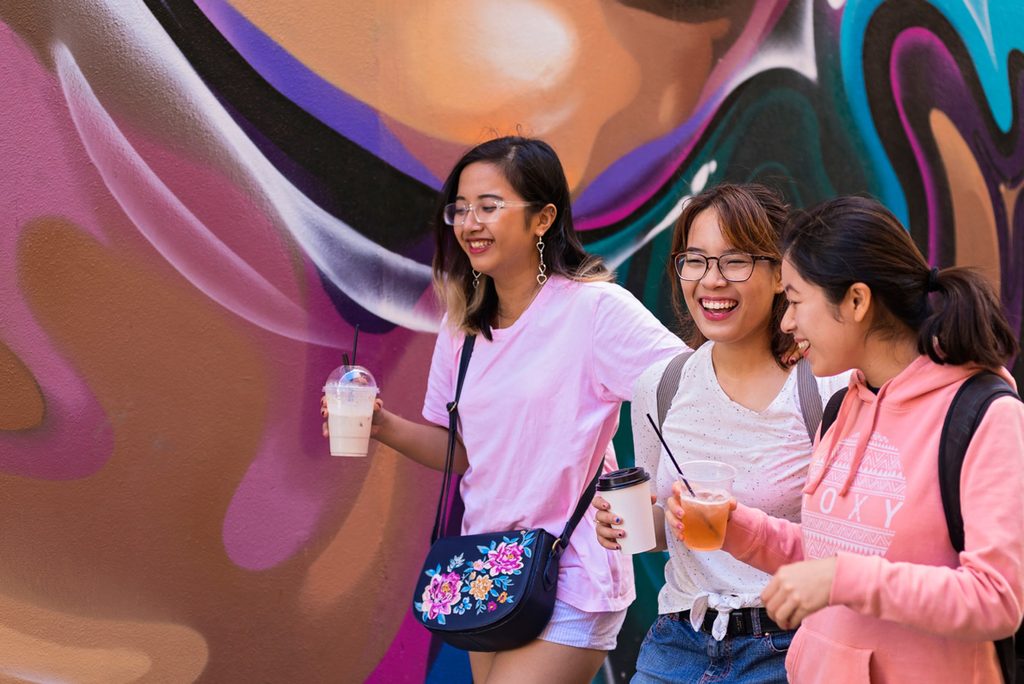 Group of happy students walking