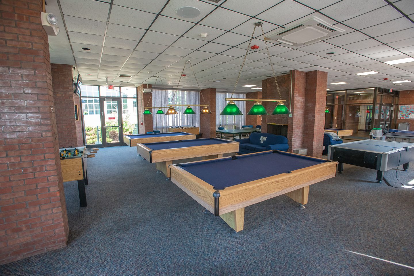 Residential Life game room with foosball and pool tables