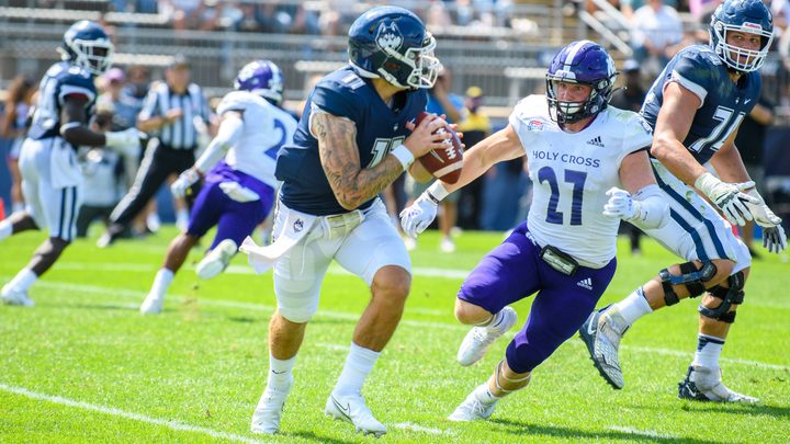 Quarterback looks to pass the ball during the UConn football game