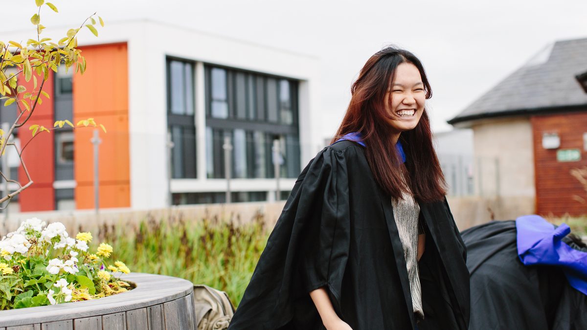 A NTIC student smiling on her graduation day