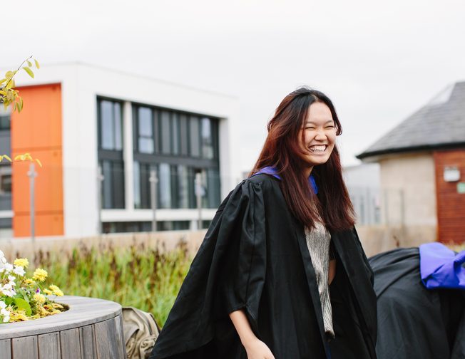 A NTIC student smiling on her graduation day