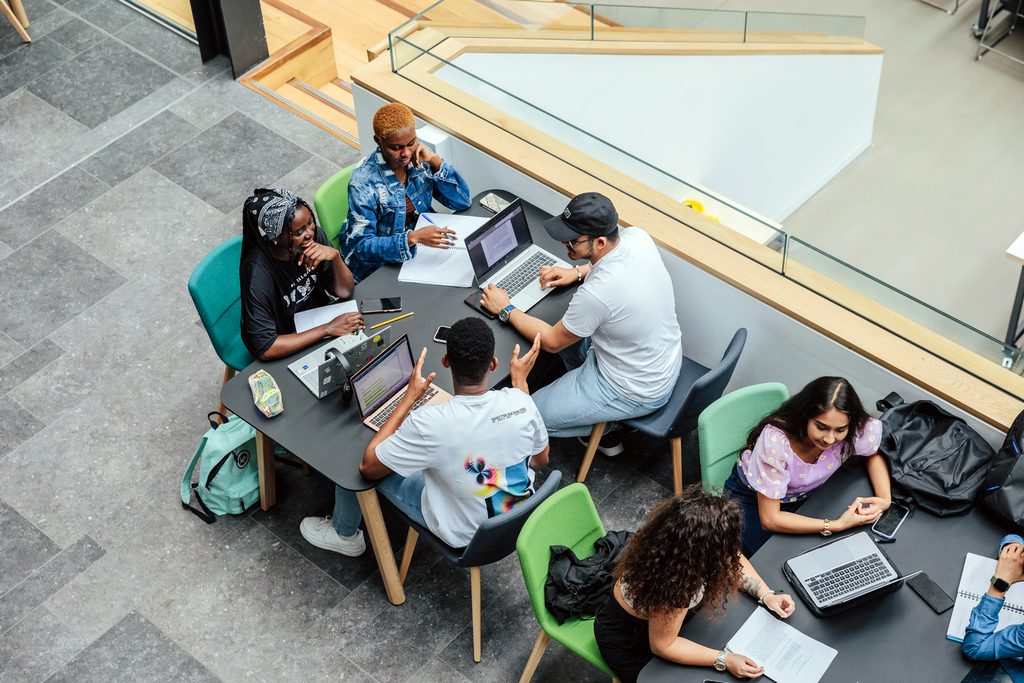 A group of students doing their coursework in campus