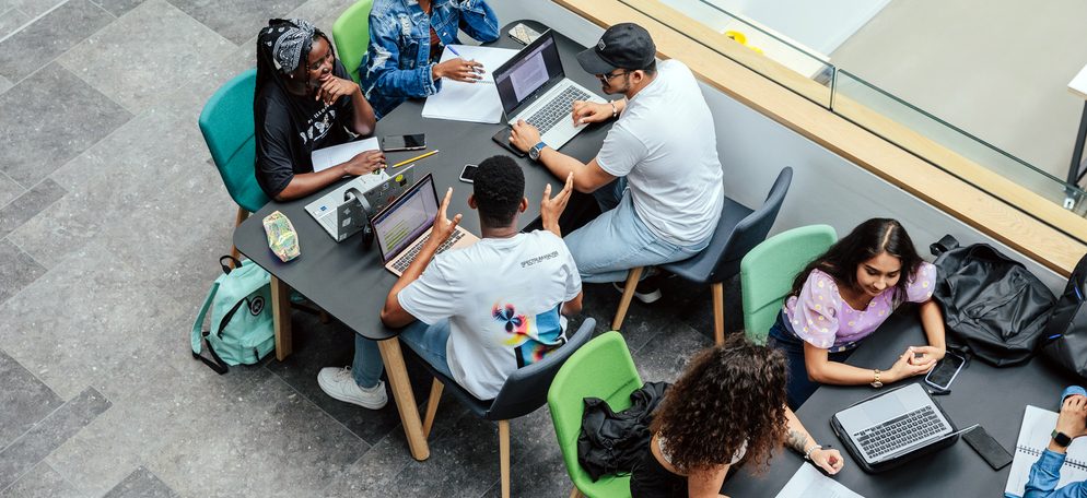 A group of students doing their coursework in campus