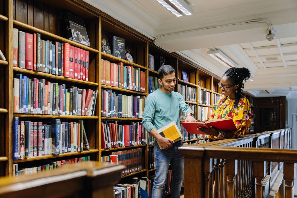Two University of Westminster students in the library