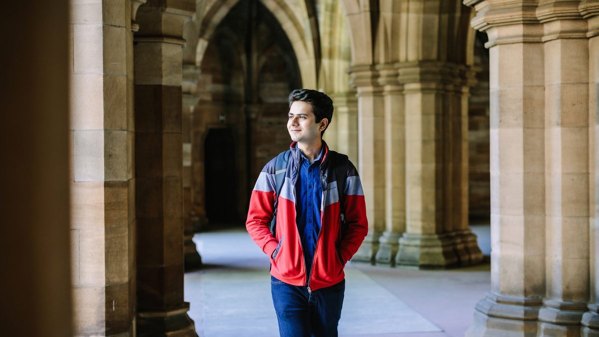 student walking in Glasgow university campus