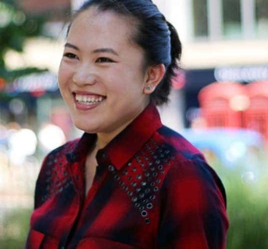 Jin, a student from China, smiles