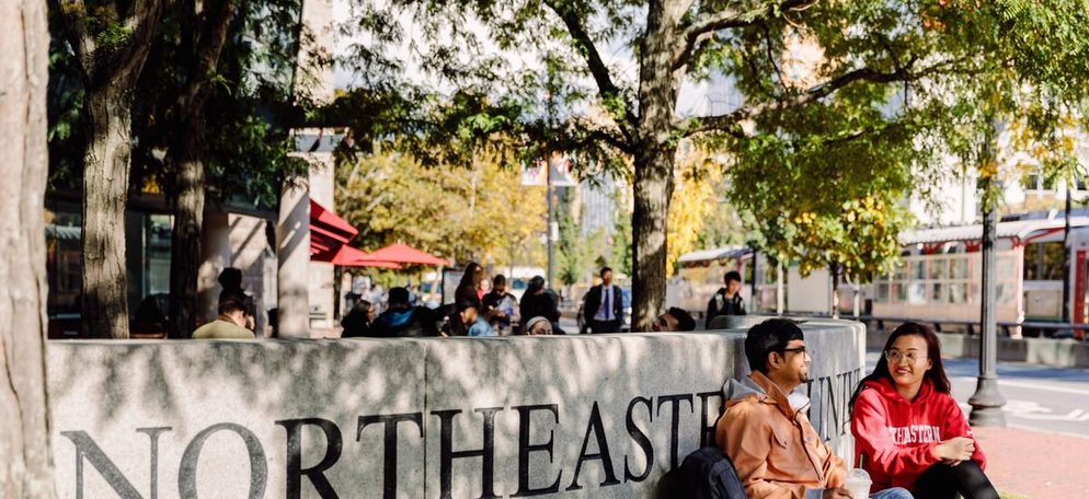 Students sitting outside Northeastern University