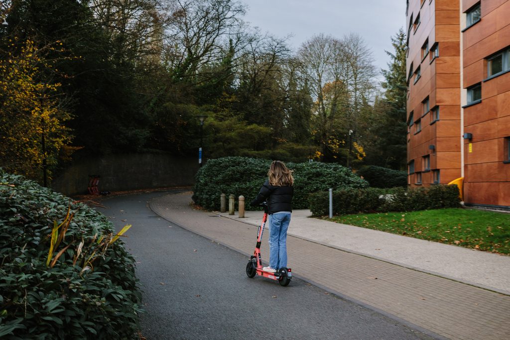 Students using a phone to take a group selfie
