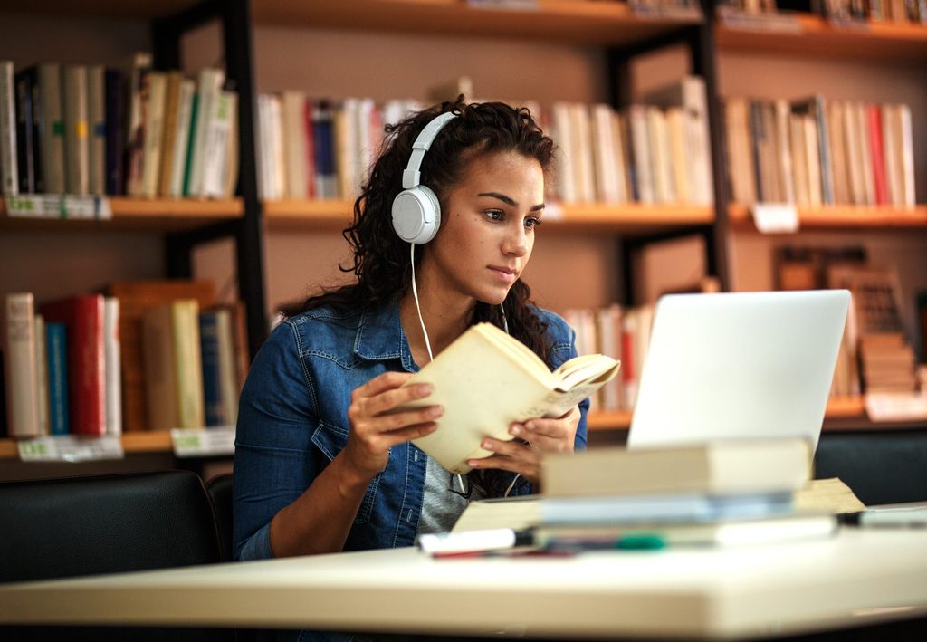 A student on her laptop in the library