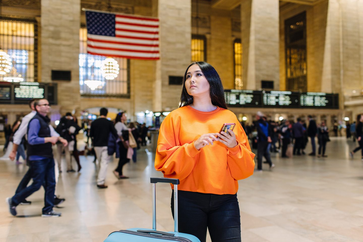 student checking train schedule at the train station