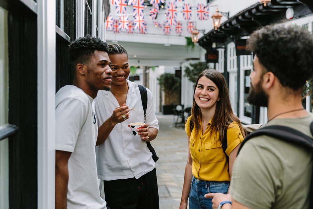 A group of UEIC having ice cream and laughing